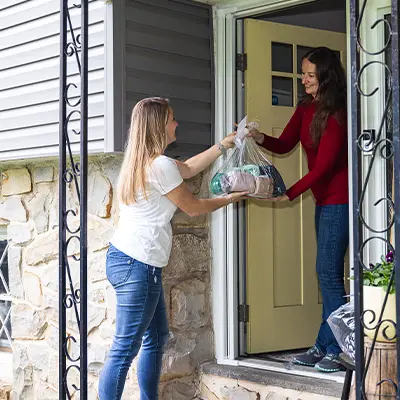 Lesssen the Loads Team Member delivering to a residential home