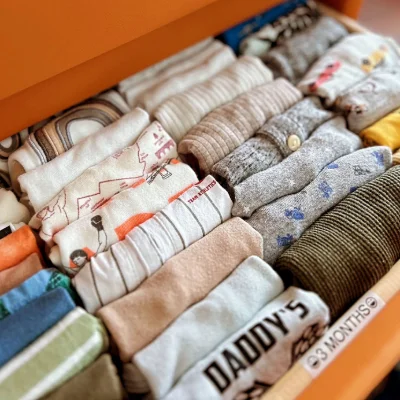 Neatly folded shirts in a drawer