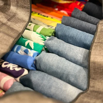 A close up of neatly folded clothes in a delivery bag