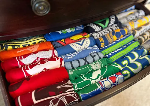 Folded shirts in a drawer at a Residential Home